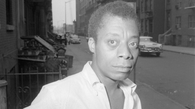 Author James Baldwin is shown on a Harlem street in New York City in June 1963 (AP Photo)