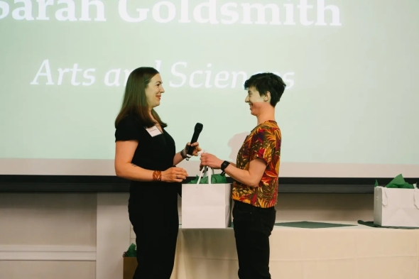 Sarah Goldsmith, right, lab technician with the Hicks Pries Lab, Arts and Sciences, receives the Passion and Commitment Award from Associate Professor of Biological Sciences Caitlin Hicks Pries. (Photo by Robert Gill)